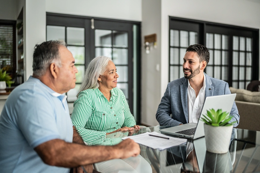 Senior couple consulting with financial advisor.