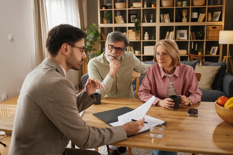 Meeting with advisor at home table.